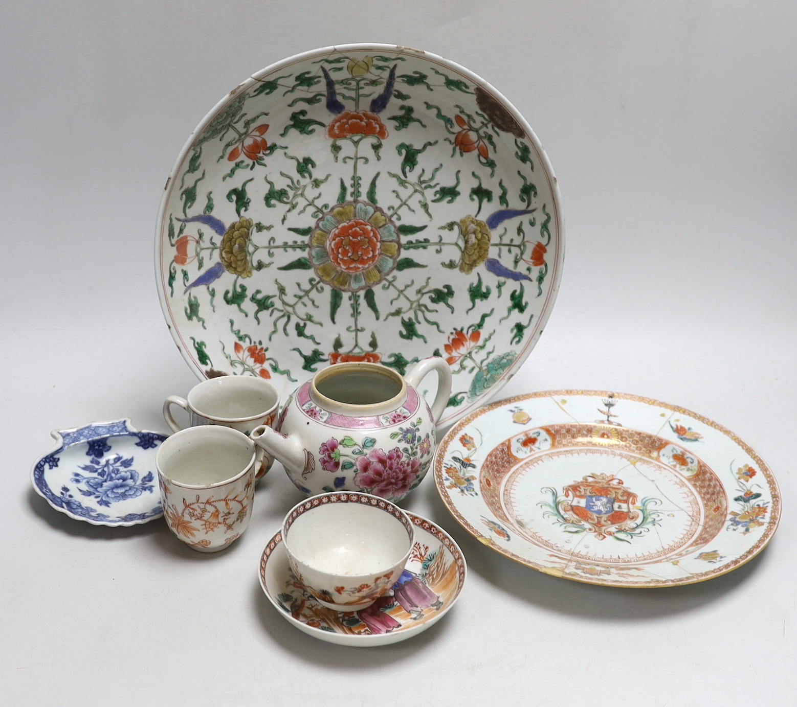 Collection of 18th century Chinese porcelain including an armorial dish, teapot hand painted in the famille rose palette and pair of cups hand painted with flowers, the largest 28cm high